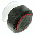 Small round waterproof Bluetooth speaker with a hanging hook, beaded with water droplets — view 6