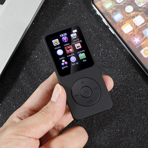 Compact music player with a small colour screen and control buttons, held in one hand — view 2